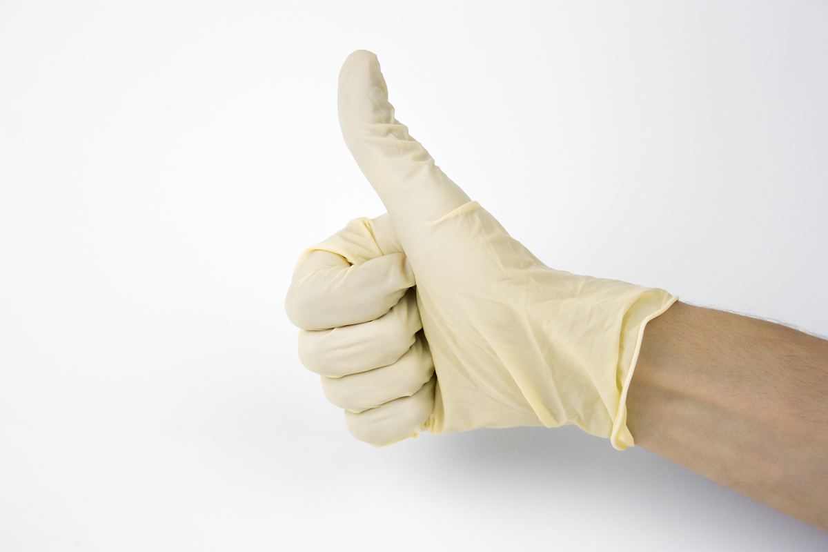 Why do latex gloves turn yellow?